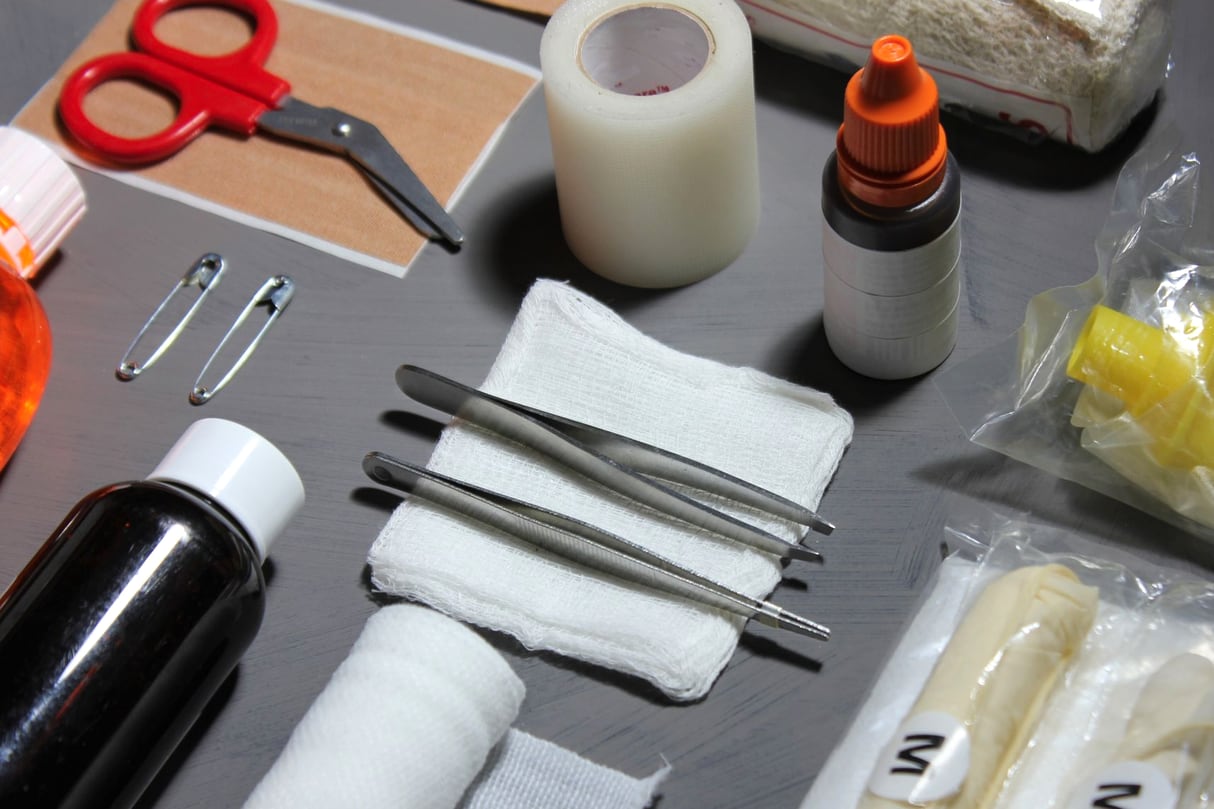 First-aid supplies including bandages and gauze on a clean surface